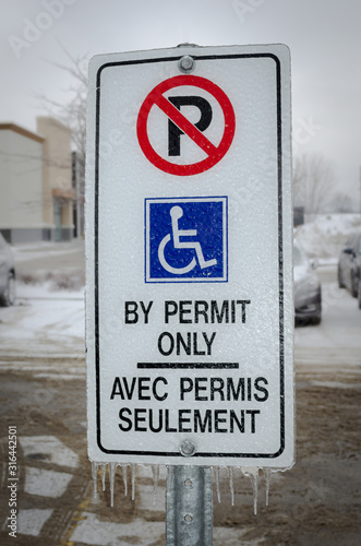 Restricted Handicapped Parking Sign in winter