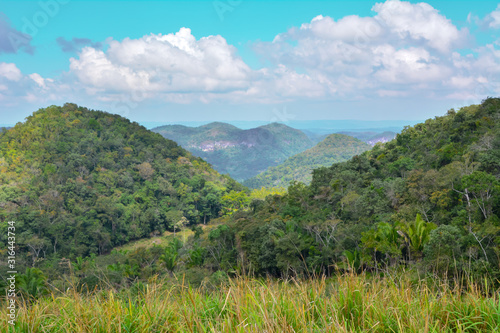 Macal River Valley, Cayo District, Belize. Scene of lush hazy forested limestone hills .