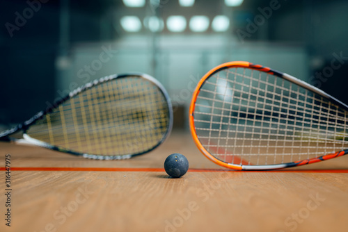 Two squash rackets and ball, game concept photo