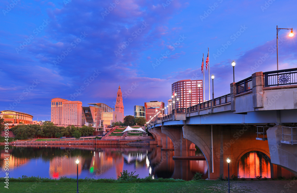 The skyline of Hartford, Connecticut before sunrise. Photo shows Founders Bridge and Connecticut