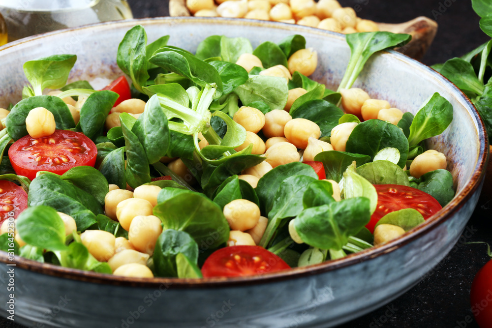 chickpea salad with ingredient and tomatoes and lamb´s lettuce. healthy salad chickpea salad with ingredient and tomatoes and lamb´s lettuce. healthy salad