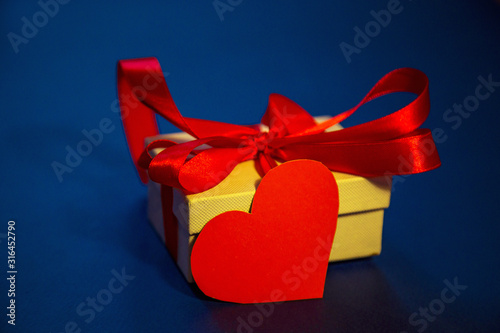 blue background, with space for text, with red flowers, postcard for Valentine's day and March 8, international women's day photo