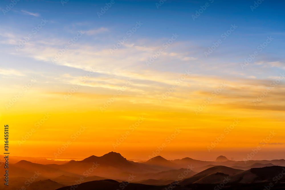 Silhouette Mountains at Sunset from View
