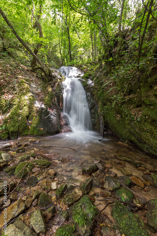 Fototapeta premium Gabrovo waterfall in Belasica Mountain,North Macedonia
