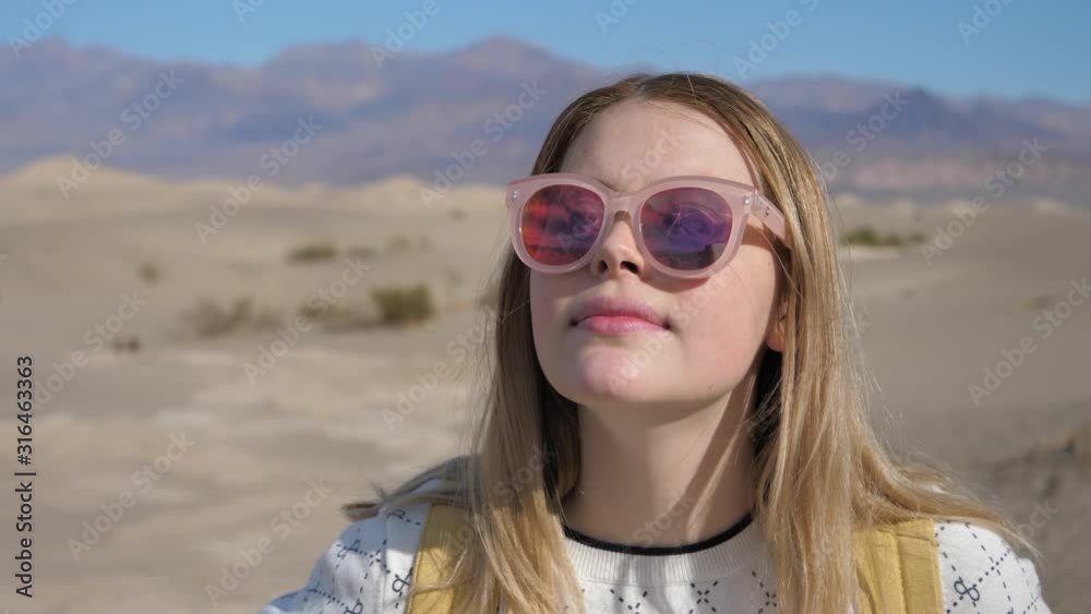 Closeup travel and adventure portrait of young woman on holiday desert explore Closeup travel and adventure portrait of young woman on holiday desert explore