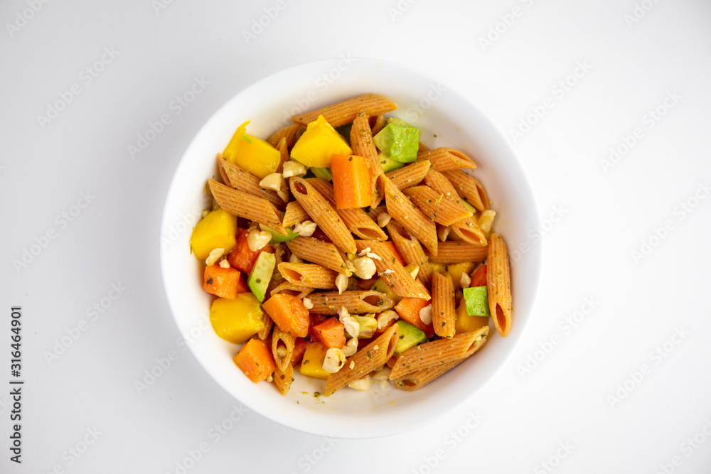 Red Papaya, avocado and mango with Basil paste lentil pasta Red Papaya, avocado and mango with Basil paste lentil pasta