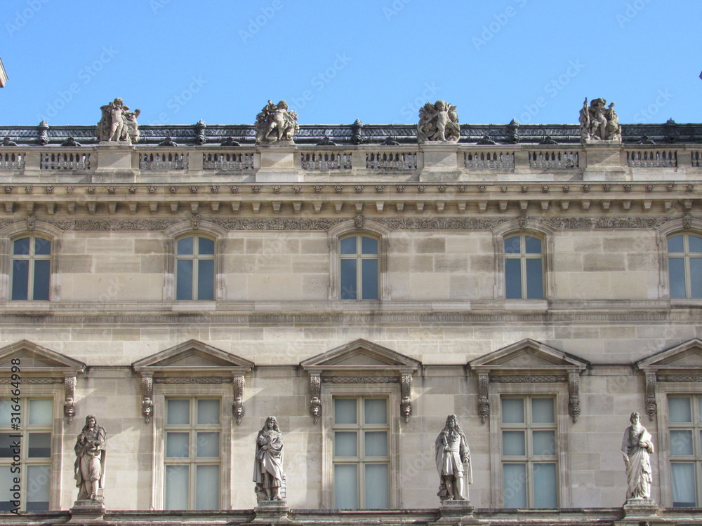 View of the Louvre Palace from within the main courtyard in Paris, France 
