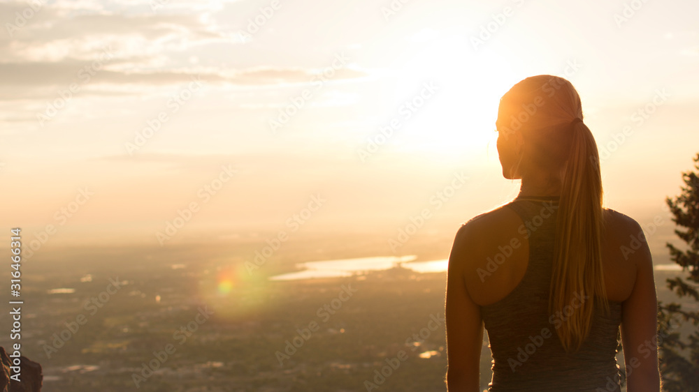 silhouette of a woman at sunrise