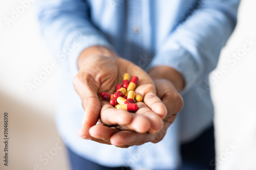 Hand Holding Prescription Medication Pills