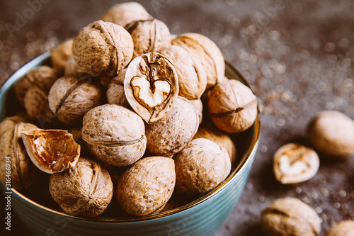 Walnuts in a bowl. Healthy food and snack.