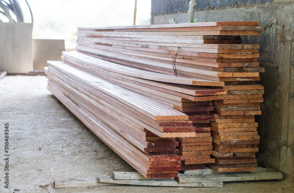 Stack stock of edging red meranti wood lumber board for building swallows nest. Stack stock of edging red meranti wood lumber board for building swallows nest.