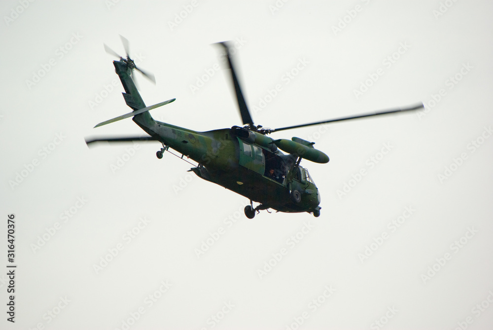 military helicopter is hoverring military helicopter is hoverring