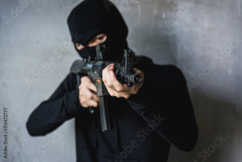Commando with Helmet holding M16 gun