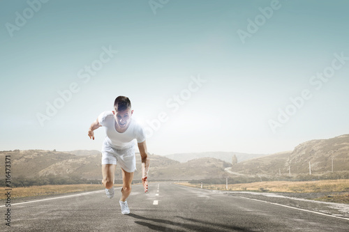 Athlete man running race. Mixed media