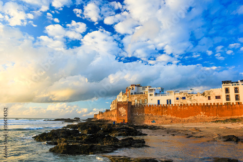 Ancient walls of the medina in Essaouira at sunset clouds  photographed using a polarizing filter