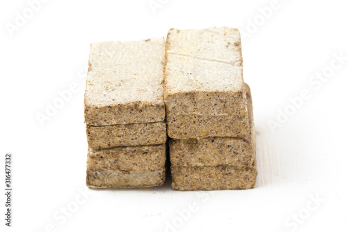 Tempe Gembus is one of the traditional foods which is the result of fermented tofu by Rhizopus, isolated on white background photo