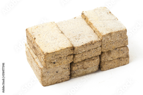 Tempe Gembus is one of the traditional foods which is the result of fermented tofu by Rhizopus, isolated on white background photo