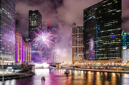 A beautiful timelapse shot of fireworks near the Chicago River at Wolf Point in Chicago, USA