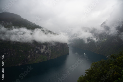 Fjord Geiranger fjord In the fog, view from viewing point, Norway. Travel destination