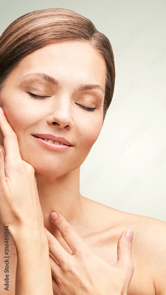 Natural beauty portrait with hands. Cosmetology mature woman face. Cosmetic cream. Skin care. Elegant girl Natural beauty portrait with hands. Cosmetology mature woman face. Cosmetic cream. Skin care. Elegant girl