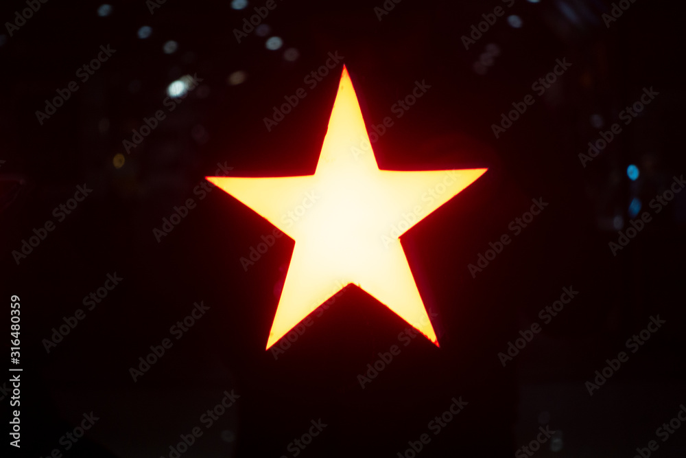 A glowing star lamp in the darkness A glowing star lamp in the darkness