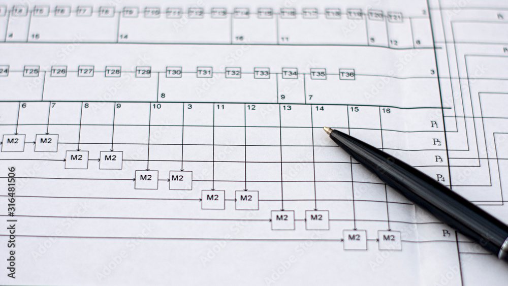 the black handle rests on a large drawing diagram on the right side the black handle rests on a large drawing diagram on the right side