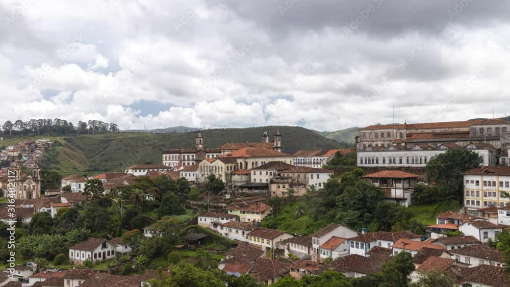 Motion time lapse of clouds rolling over the colonial mining city of Ouro Preto in Brazil panning from the historic city centre to the Itacolomi mountain peak Motion time lapse of clouds rolling over the colonial mining city of Ouro Preto in Brazil panning from the historic city centre to the Itacolomi mountain peak