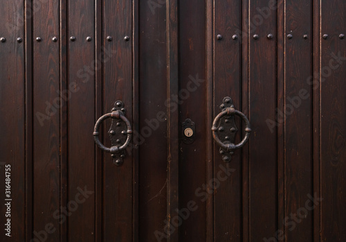 Lock door in house and black knob and wall background. © Praew stock