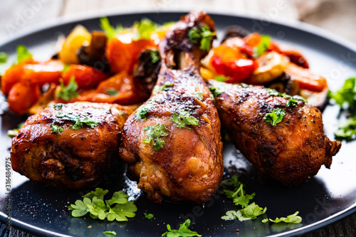 Barbecue chicken drumsticks with roast vegetables