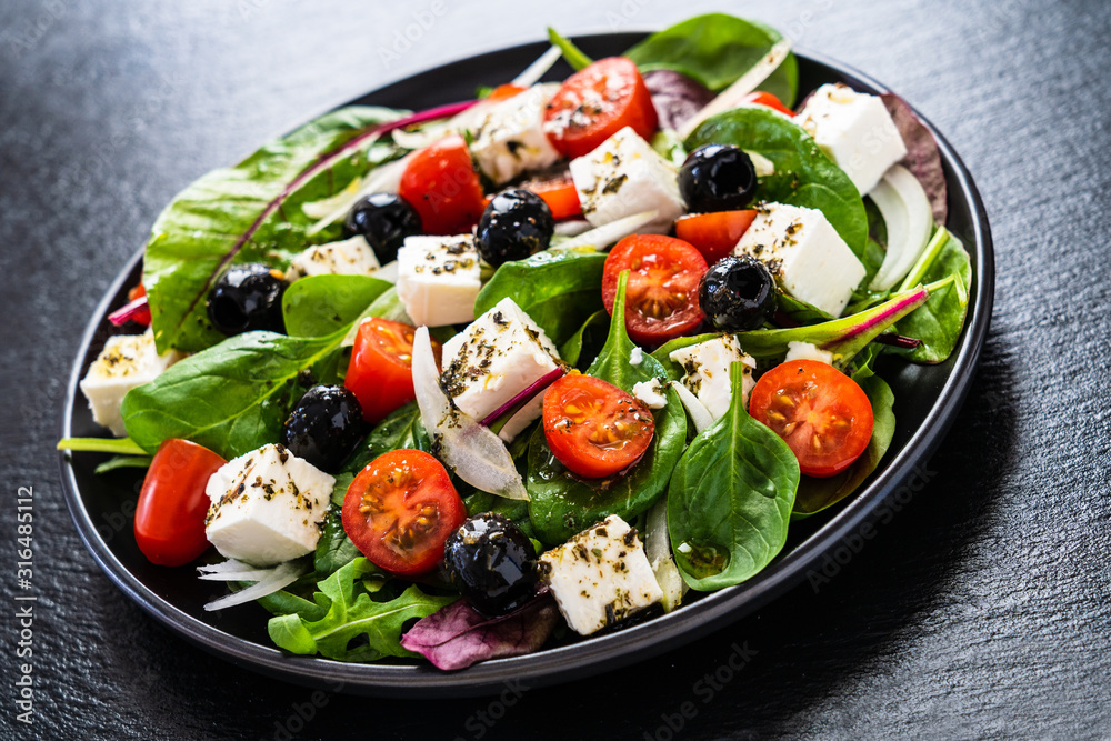 Fresh greek salad - feta cheese, tomato, lettuce, black olives and onion Fresh greek salad - feta cheese, tomato, lettuce, black olives and onion