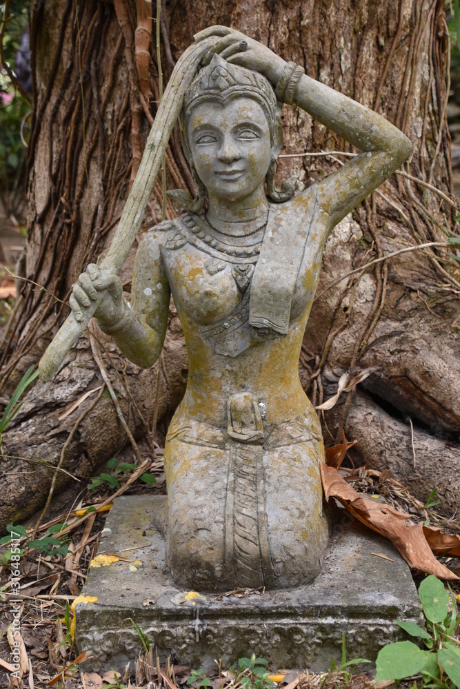 Statue of Lao Woman Kneeling, Washing Hair, Cool Hues, Portrait