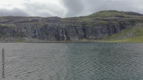 Aerial footage of Aurlandsfjellet, Flotvatnet Lake With Waterfall Flotane in Summer photo