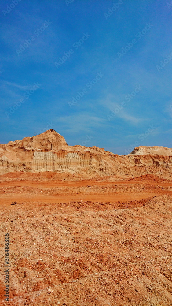 Old mining Red surface land like canyon dry hill material Old mining Red surface land like canyon dry hill material