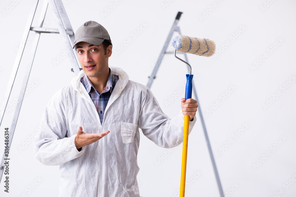 Painter working at construction site Painter working at construction site