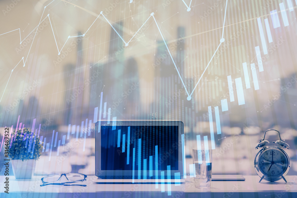 Forex graph hologram on table with computer background. Multi exposure. Concept of financial markets.