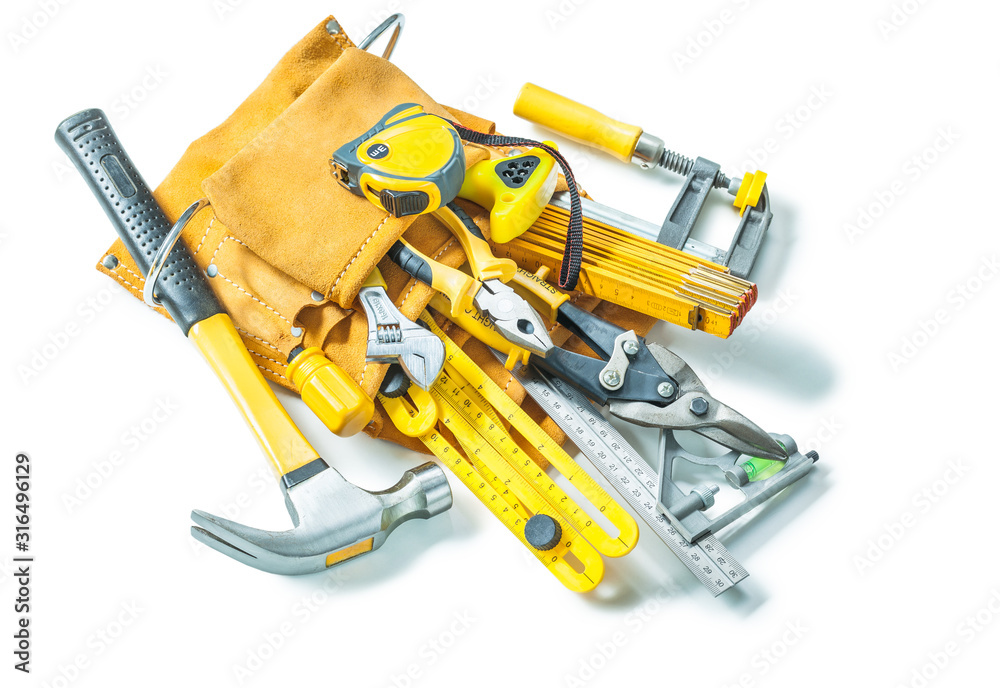construction tools in leather toolbelt isolated on white background construction tools in leather toolbelt isolated on white background