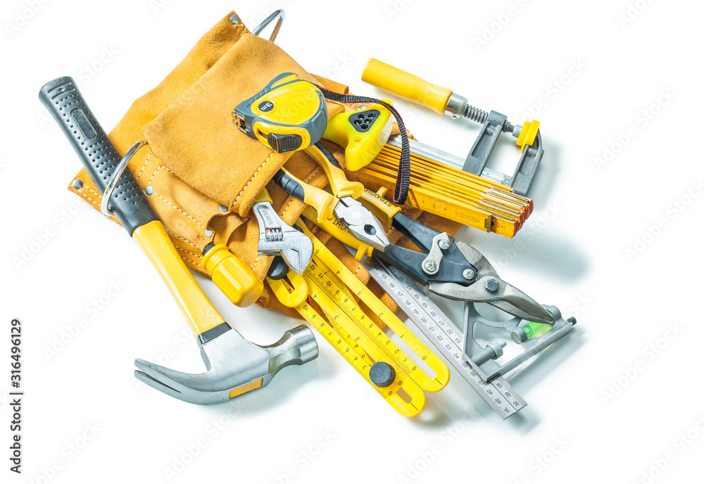 construction tools in leather toolbelt isolated on white background