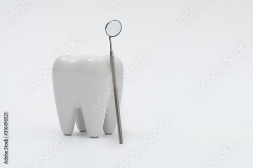 tooth dentist mirror isolated on white © onairjiw
