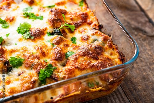 Pasta casserole with barbecue chicken breast, cheese and vegetables photo