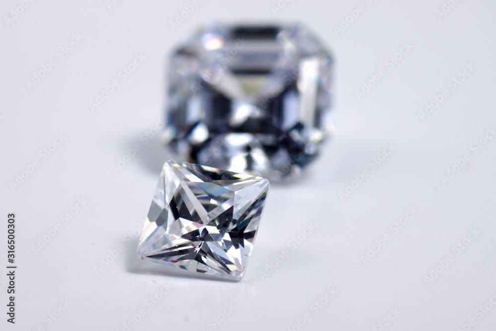 Briliant sparkling clear diamond, close up shoot on isolated background Briliant sparkling clear diamond, close up shoot on isolated background