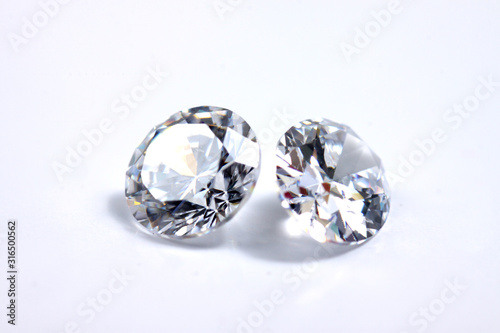 Macro shoots of a group of diamonds that has different shapes  heart  round  pear  asscher  oval  princess  isolated background