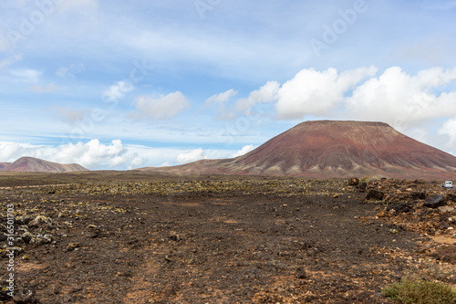 Scenic view at the volcanic landscape in the natural park of Corralejo (Parque Natural De Corralejo) on canary island Fuerteventura