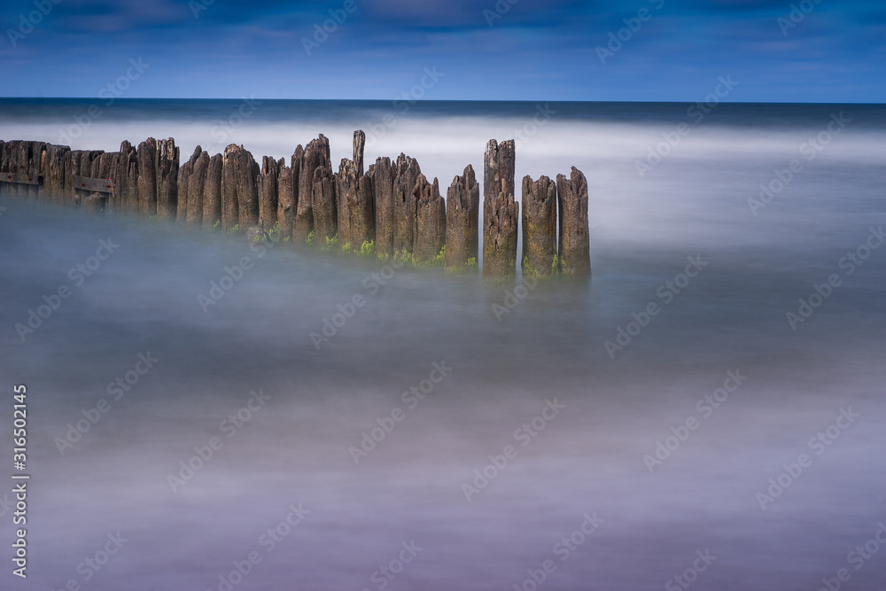 Old harbor ruins. Blue sea and port. Harbour in Baltic sea, Latvia, Europe