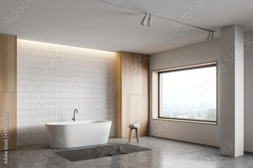 White and wooden bathroom corner  tub and column