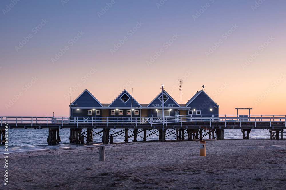View of the 4 iconic huts at the start of Busselton Jetty, captured at dawn; Busselton is a popular tourist destination in Western Australia