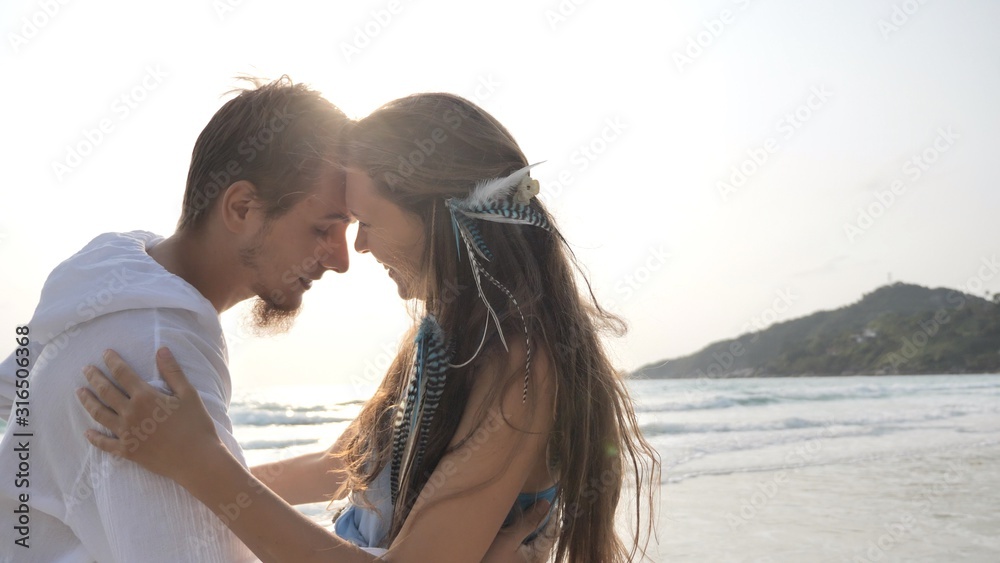 Couple in love spend time at sand tropical beach of Thailand island Couple in love spend time at sand tropical beach of Thailand island