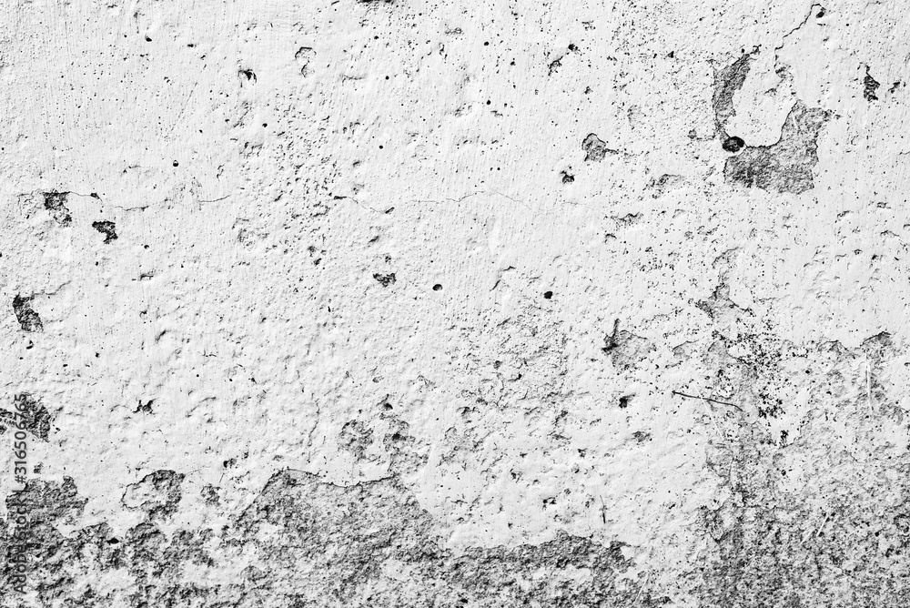 Texture of a concrete wall with cracks and scratches which can be used as a background Texture of a concrete wall with cracks and scratches which can be used as a background