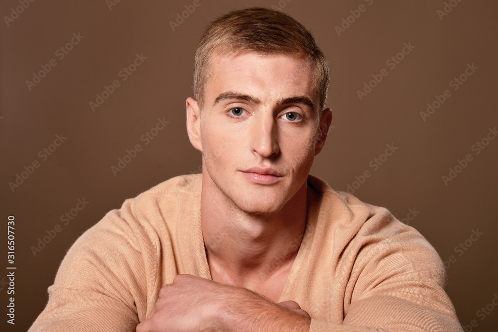 Obraz premium Portrait of handsome young man posing in studio