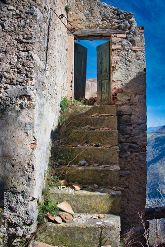 Fototapeta Naklejka Na Ścianę i Meble -  Stairs in an Abandoned Village in the Mountains of Southern Italy