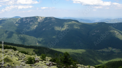 view of the Carpathian mountains on a sunny summer day from the top of Khomyak Mountain, Carpathians, Ukraine